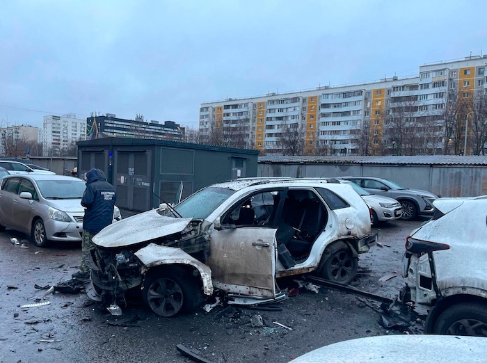This photo provided by Investigative Committee of Moscow on Monday, Dec. 22, 2025, shows an investigator working at the scene where Lt. Gen. Fanil Sarvarov, head of the Operational Training Directorate of the Russian Armed Forces General Staff, was killed by an explosive device placed under his car in Moscow. (Investigative Committee of Moscow via AP)
