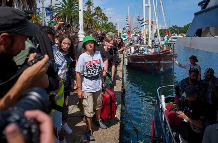 Swedish climate activist Greta Thunberg arrives to board a boat taking part in a civilian flotilla bound for Gaza, aiming to break the Israeli blockade and deliver humanitarian aid, in Barcelona, Spain on Aug. 31. (Emilio Morenatti/AP)