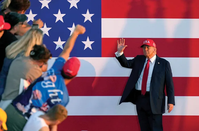 Why do supporters of President Donald Trump fail to vote for Republicans in sufficient numbers when he is not on the ballot? (Charlie Neibergall/AP)