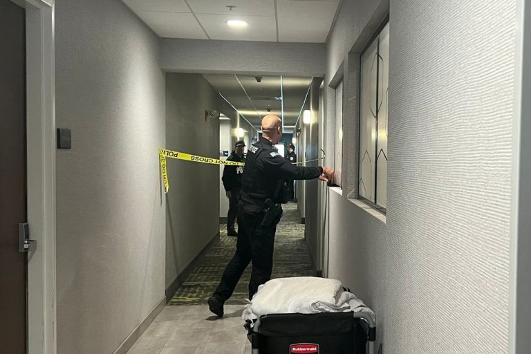 Police search a hotel room in Rhode Island.