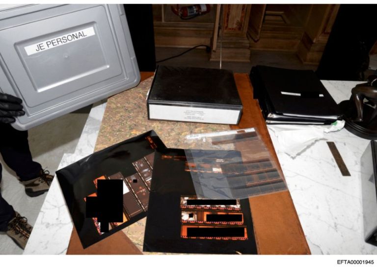 A redacted image of files related to Epstein.