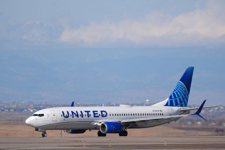 A United plane sits on the runway.