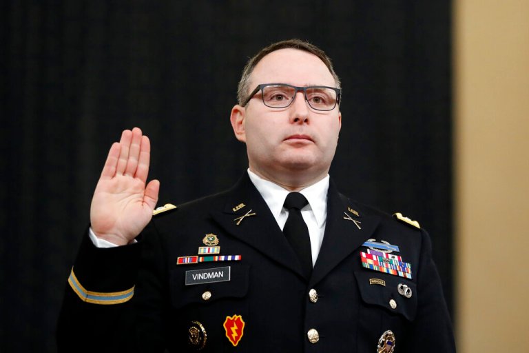 National Security Council aide Lt. Col. Alexander Vindman is sworn in to testify before the House Intelligence Committee on Capitol Hill in Washington, Tuesday, Nov. 19, 2019, during a public impeachment hearing of President Donald Trump's efforts to tie U.S. aid for Ukraine to investigations of his political opponents.
