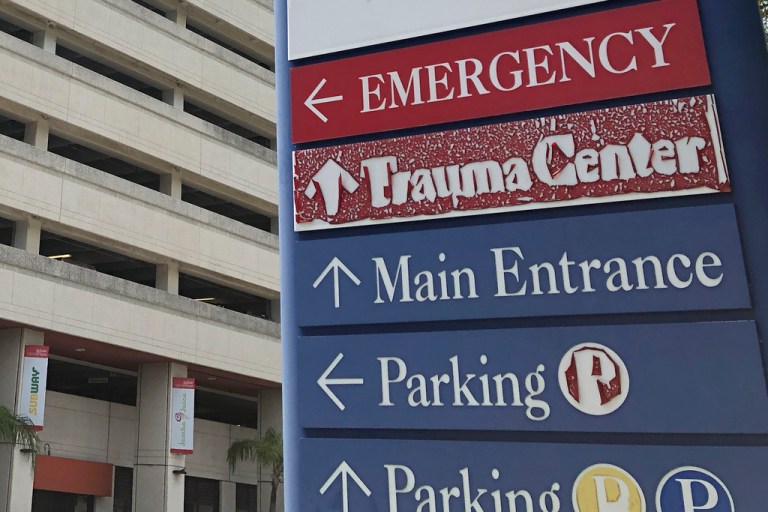 A sign showing directions outside a hospital in Miami.