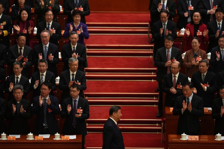 Chinese President Xi Jinping arrives for the closing ceremony of the Chinese People's Political Consultative Conference held at the Great Hall of the People in Beijing.