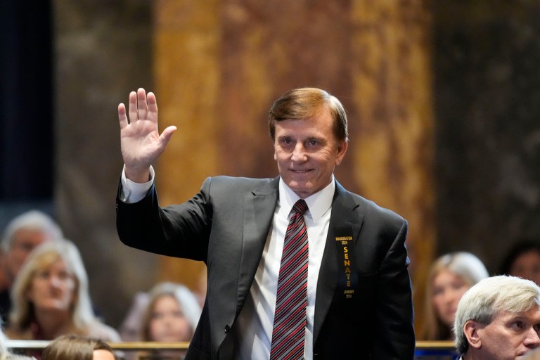 Louisiana State Treasurer John Fleming waves as he is introduced during the swearing in of the Louisiana state legislature in Baton Rouge, La., Jan. 8, 2024.