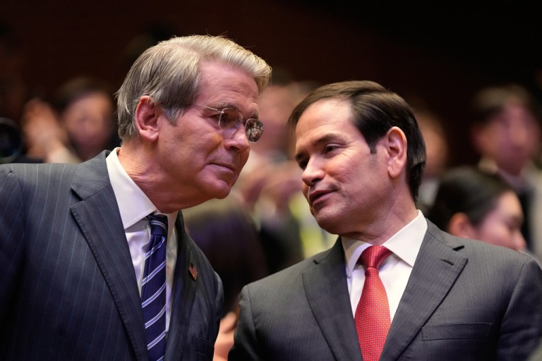 Treasury Secretary Scott Bessent and Secretary of State Marco Rubio speak to each other before President Donald Trump speaks at an Asia-Pacific Economic Cooperation CEO luncheon in Gyeongju, South Korea.