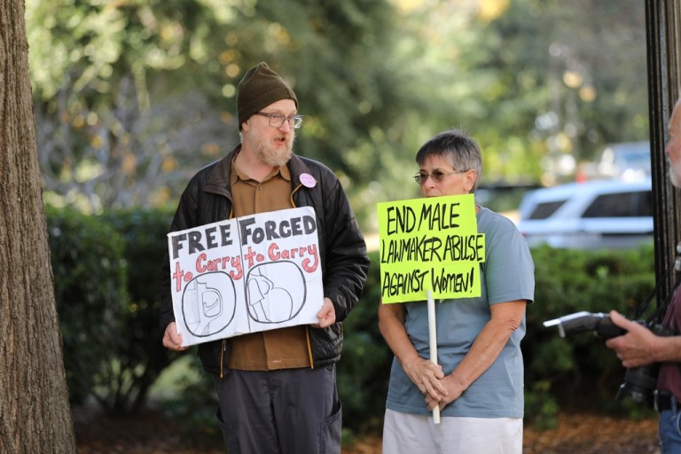 Protesters stand outside the Gressette Building for a South Carolina Senate subcommittee on a bill that would ban almost all abortions