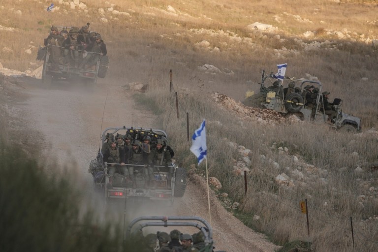 Israeli soldiers cross the security fence moving toward the so-called Alpha Line that separates the Israeli-annexed Golan Heights from Syria.