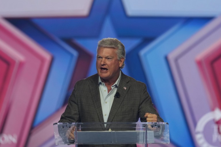 Rep. Mike Collins (R-GA) speaks during Turning Point USA's AmericaFest 2025.