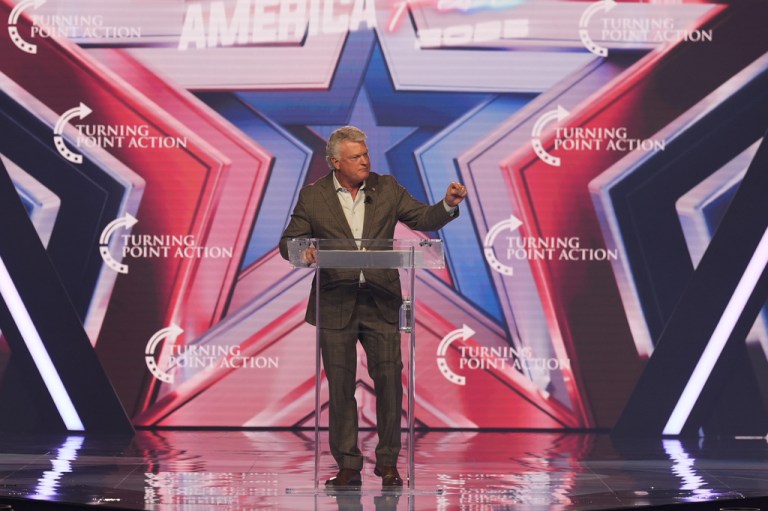 Rep. Mike Collins (R-GA) speaks during Turning Point USA's AmericaFest 2025.