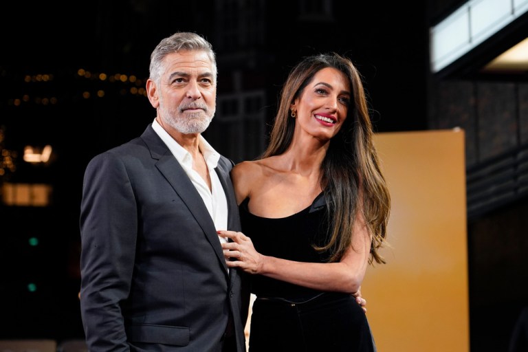 FILE - George Clooney and his wife Amal Clooney pose for photographers upon arrival at the screening of the film 
