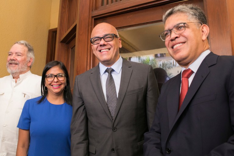 Constitutional Assembly President Delcy Rodriguez, and her brother, Minister of Communications Jorge Rodriguez, flanked by diplomat Roy Chaderton.