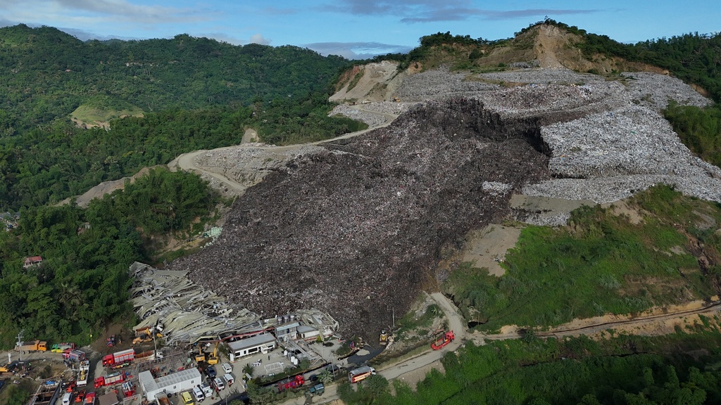 Filipino rescuers detect ‘signs of life’ in garbage avalanche that killed 4 and left dozens missing