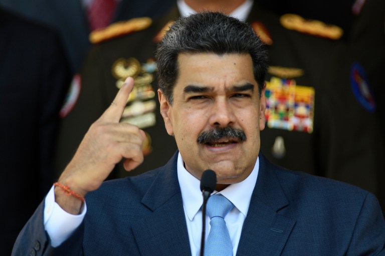 In this March 12, 2020, photo, Venezuelan President Nicolas Maduro gives a press conference at the Miraflores presidential palace in Caracas, Venezuela.
