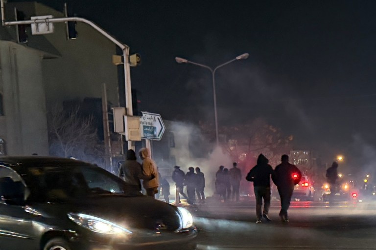 Protesters are tear-gassed in the streets of Tehran