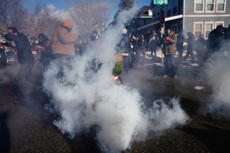 Tear gas is deployed amid protesters near the scene where Renee Good was fatally shot by an ICE officer last week, Tuesday, Jan. 13, 2026, in Minneapolis.
