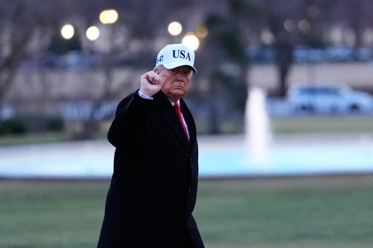 President Donald Trump gestures as he walks from Marine One after arriving on the South Lawn of the White House.