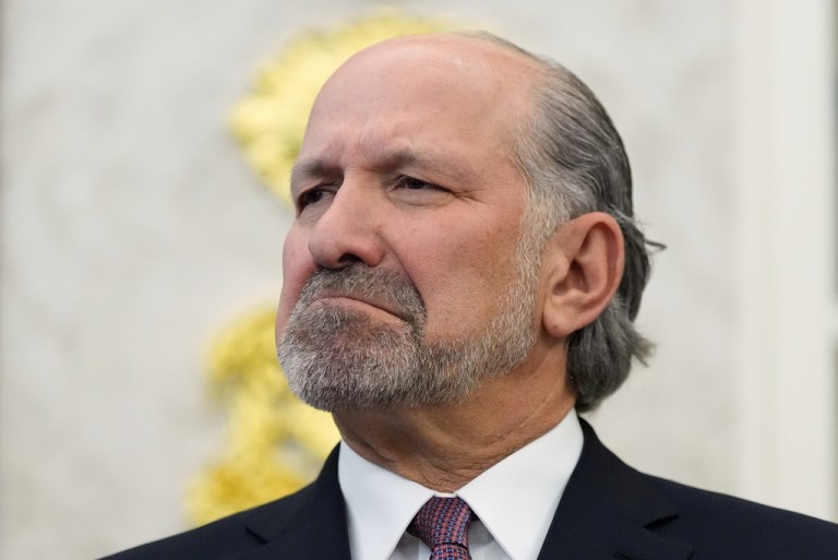 Commerce Secretary Howard Lutnick listens during an event with President Donald Trump in the Oval Office of the White House.