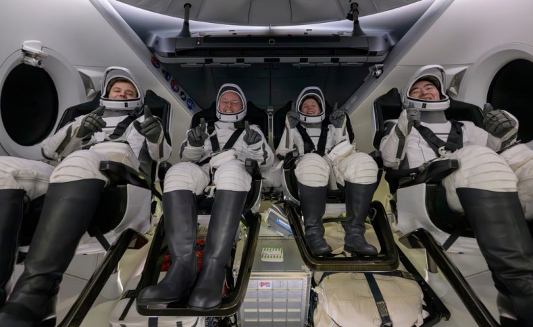 Roscosmos cosmonaut Oleg Platonov, left, NASA astronauts Mike Fincke, Zena Cardman, and JAXA (Japan Aerospace Exploration Agency) astronaut Kimiya Yui are seen inside the SpaceX Dragon Endeavour spacecraft onboard the SpaceX recovery ship SHANNON shortly after having landed in the Pacific Ocean off the coast of Long Beach, California