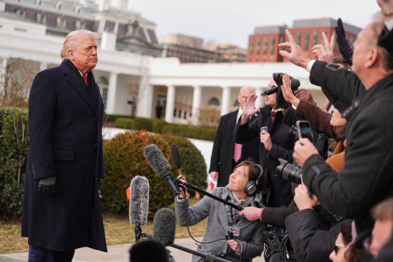 President Donald Trump takes questions from reporters before departing on Marine One from the South Lawn of the White House.