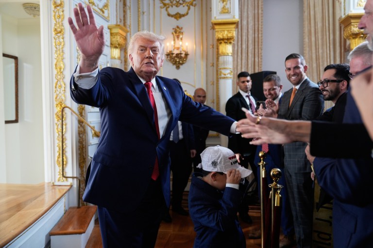 President Donald Trump shakes hands with supporters at a dedication ceremony for a portion of Southern Boulevard, which the Town of Palm Beach Council recently voted to rename,
