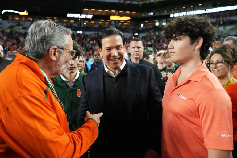Secretary of State Marco Rubio walks on the sidelines before the College Football Playoff national championship game between Miami and Indiana, Monday, Jan. 19, 2026, in Miami Gardens, Fla. (AP Photo/Rebecca Blackwell)