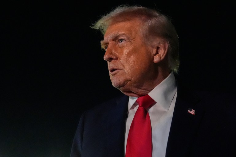 President Donald Trump speaks to reporters before boarding Air Force One at Palm Beach International Airport.