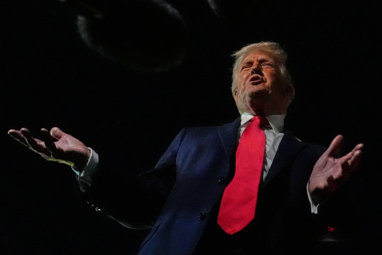 President Donald Trump speaks to reporters before boarding Air Force One