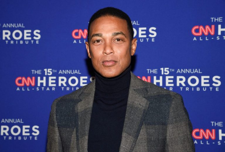 Don Lemon attends the 15th annual CNN Heroes All-Star Tribute with gray suit jacket on top of black high-neck top at the American Museum of Natural History, Sunday, Dec. 12, 2021, in New York. (Photo by Evan Agostini/Invision/AP, File)