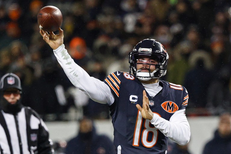 Chicago Bears quarterback Caleb Williams (18) passes the ball against the Los Angeles Rams during the second half of an NFL divisional playoff football game, Sunday, Jan. 18, 2026, in Chicago. (AP Photo/Kamil Krzaczynski)