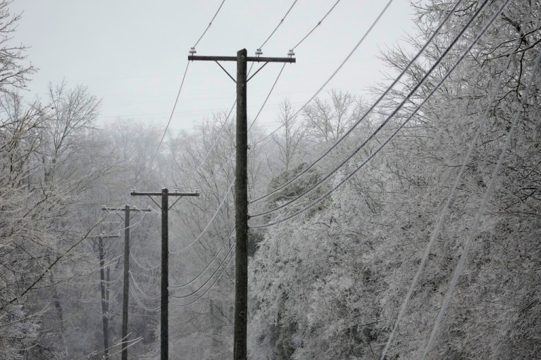 Power lines covered with ice are seen during a winter storm Sunday, Jan. 25, 2026, in Nashville, Tenn. (AP Photo/George Walker IV)