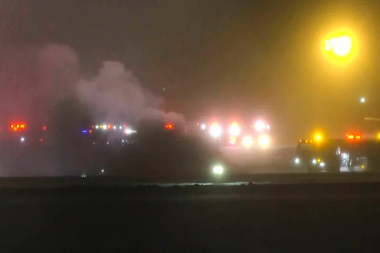 Smoke arises after a plane crashes in Bangor, Maine