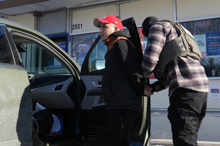 A man is detained by federal agents Tuesday, Jan. 27, 2026, in Minneapolis. (AP Photo/Adam Gray)