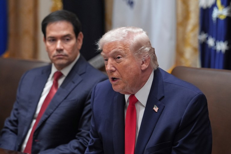 President Donald Trump speaks as Secretary of State Marco Rubio listens during a cabinet meeting at the White House