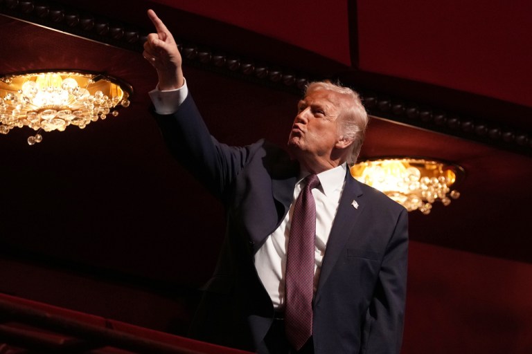 President Donald Trump gestures before the premiere of first lady Melania Trump's movie 