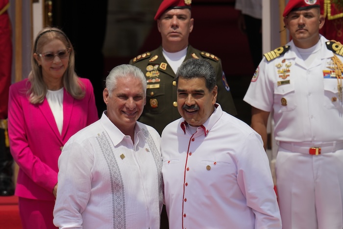 Venezuelan President Nicolas Maduro, right, poses for photos with Cuba's President Miguel Diaz-Canel before the start of a summit by the Bolivarian Alliance for the Peoples of Our America&nbsp;(ALBA) at Miraflores presidential palace in Caracas, Venezuela, Wednesday, April 24, 2024. (AP Photo/Ariana Cubillos)