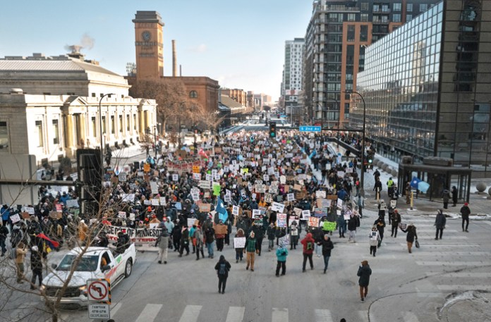 MINNEAPOLIS, MINNESOTA - JANUARY 25: Demonstrators march through downtown protesting ICE operations and the death of Renee Good and Alex Pretti on January 25, 2026 in Minneapolis, Minnesota. Pretti, an ICU nurse at a VA medical center, died yesterday after being shot multiple times during a brief altercation with border patrol agents in the Eat Street district of Minneapolis. Good was killed by an ICE agent on January 7. (Photo by Scott Olson/Getty Images)