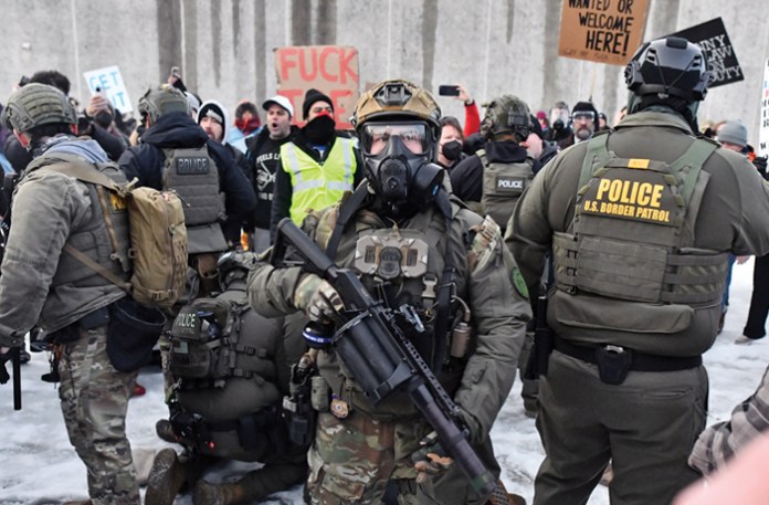 Protestors clash with federal agents outside the Bishop Henry Whipple Federal Building in Saint Paul, Minnesota, on January 8, 2026. (Octavio Jones/Getty)