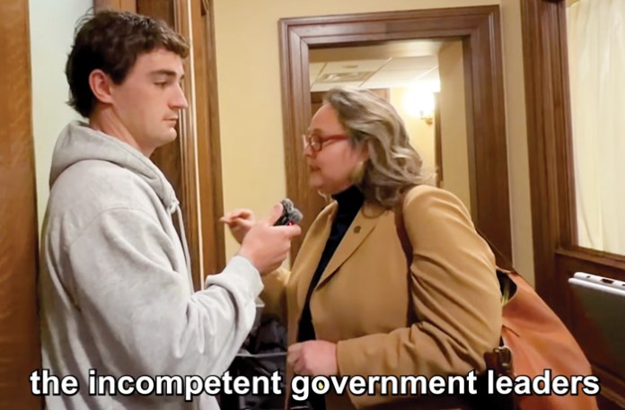 Shirley questions Minnesota Democratic state Rep. Emma Greenman in the state Capitol building after a hearing in which Greenman decried the attention being paid to the alleged fraud and insisted that it is not a partisan issue. (Nick Shirley/YouTube)