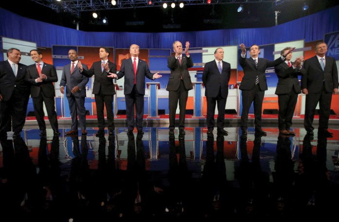 Republican presidential candidates from left: Chris Christie, Marco Rubio, Ben Carson, Scott Walker, Donald Trump, Jeb Bush, Mike Huckabee, Ted Cruz, Rand Paul, and John Kasich take the stage for the first Republican presidential debate in Cleveland, Ohio, on Aug. 6, 2015. (Andrew Harnik/AP)