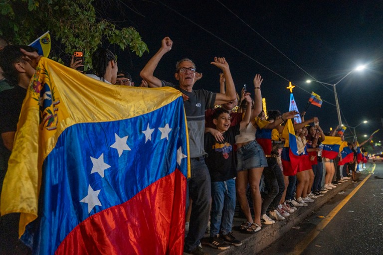 Venezuelan citizens celebrate during a rally on the Colombia-Venezuela border after the confirmation of Nicolas Maduro's capture this early morning in Caracas, on January 3, 2026 in Cucuta, Colombia. President Donald Trump announced that Nicolas Maduro and his wife, Cilia Flores, were captured in the early morning in Caracas after a military operation led by the Delta Force, the elite special missions unit of the U.S. military. (Photo by Jair F. Coll/Getty Images)
