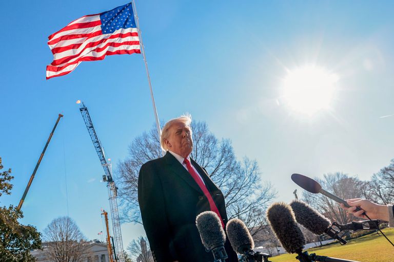 US President Donald Trump speaks to members of the media on the South Lawn of the White House before boarding Marine One in Washington, DC, US, on Tuesday, Jan. 13, 2026. Trump is traveling to Michigan after his administration floated a slew of ideas it says will build on last year's efforts to rein in inflation and lower gas prices. Photographer: Shawn Thew/EPA/Bloomberg via Getty Images