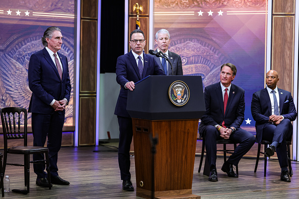 Doug Burgum, U.S. secretary of the interior, from left, Gov. Josh Shapiro, (D-PA), Chris Wright, U.S. energy secretary, Gov. Glenn Youngkin (R-VA), and Gov. Wes Moore, (D-MD), during an announcement in the South Court Auditorium of the Eisenhower Executive Office Building at the White House in D.C., on Friday, Jan. 16, 2026. The Trump administration and several states laid out a plan intended to compel technology companies to effectively fund the construction of new power plants as a way to tame surging consumer utility bills while aiding the development of data centers.