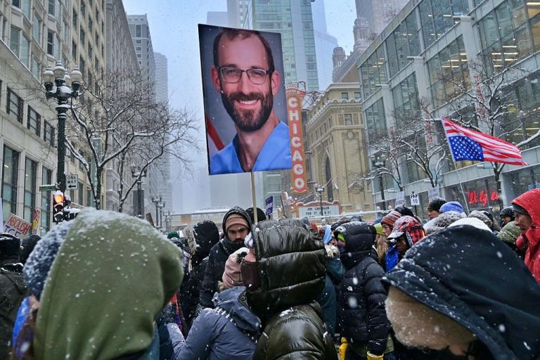 Demonstrators gather on Michigan Avenue during a heavy snowstorm to protest against U.S. Immigration and Customs Enforcement and Customs and Border Protection in Chicago on Jan. 25, 2026. The thousands in attendance joined the 'We Fight Back' rally as they called for an end to federal immigration crackdowns and the abolition of the agencies. The massive mobilization follows the recent fatal shooting of Alex Jeffrey Pretti, a 37-year-old nurse, by federal agents in Minneapolis on Jan. 24. (Photo by Jacek Boczarski/Anadolu via Getty Images)