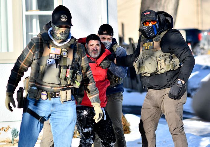 Federal immigration agents detain a man during an operation by US Immigration and Customs Enforcement and Border Patrol in St. Paul, Minnesota, on January 27, 2026.