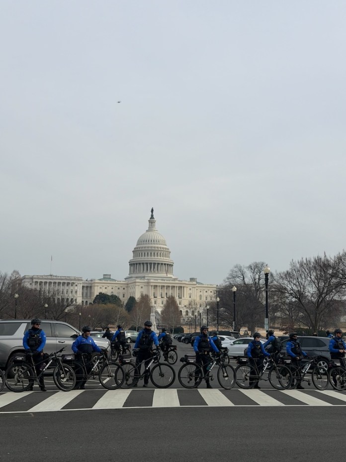 Capitol police line up outside of the U.S Capitol building as January 6 defendants and families peacefully approach. (Sydney Topf/Washington Examiner)