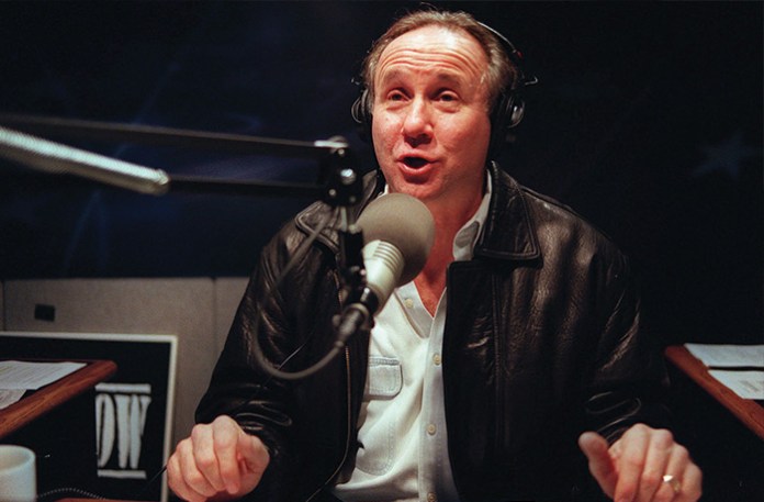 Radio talk show host Mike Reagan, son of former United States President Ronald Reagan, talks on the air at his radio station studio on Dec. 1, 1998, in Sherman Oaks section of Los Angeles. (Damian Dovarganes/AP)