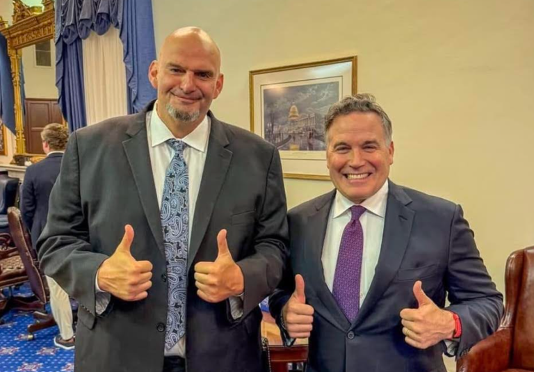 Sens. Dave McCormick (R-PA) and John Fetterman (D-PA) give thumbs up while posing for a photo.