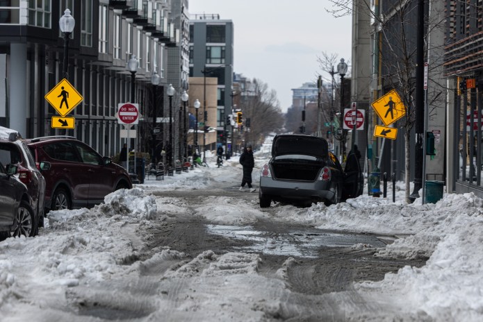 Washington, D.C. residents grapple with poor road conditions caused by winter storm. (Credit: Graeme Jennings)